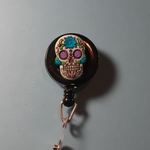 Sugar skulls retractable name badge holder